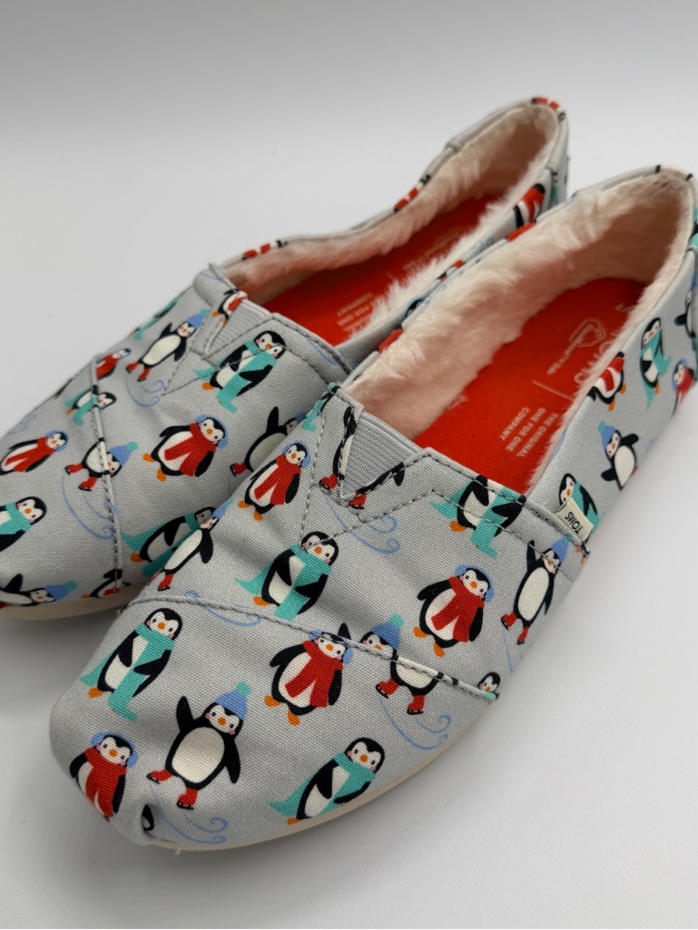 Toms Penguin-Print Slip-Ons in Light Gray with Teal and Red Accents - Picture 2 of 4